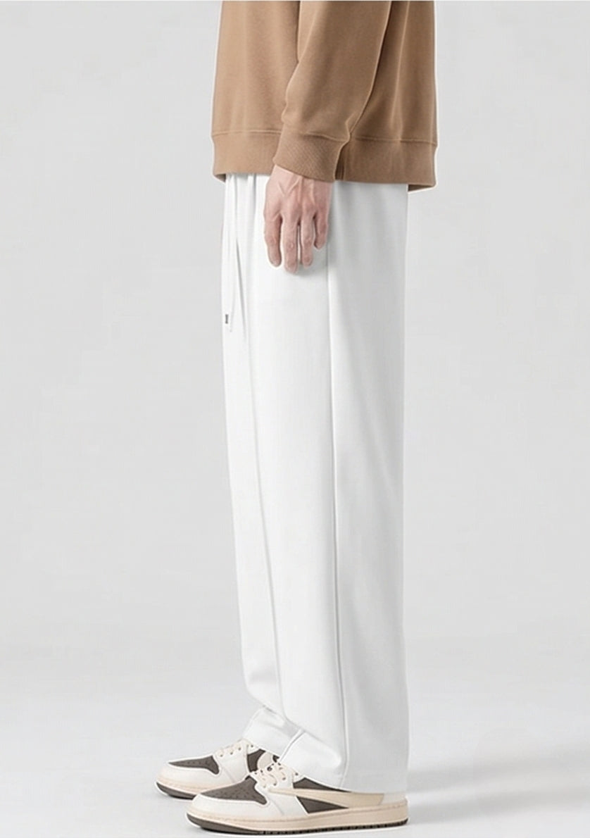 White Men's Wide-Leg Sports Trousers | Relaxed-Fit Performance Pants | Contemporary Athletic Track Pants | Versatile Activewear Bottoms | Streamlined Fitness Trousers