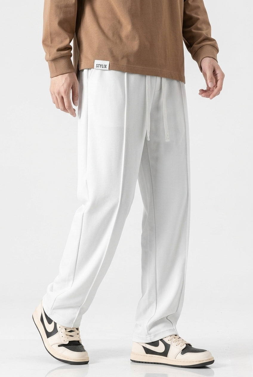 White Men's Wide-Leg Sports Trousers | Relaxed-Fit Performance Pants | Contemporary Athletic Track Pants | Versatile Activewear Bottoms | Streamlined Fitness Trousers
