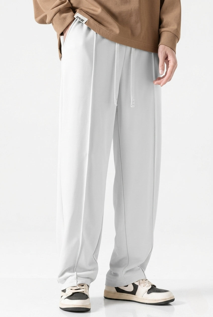 White Men's Wide-Leg Sports Trousers | Relaxed-Fit Performance Pants | Contemporary Athletic Track Pants | Versatile Activewear Bottoms | Streamlined Fitness Trousers